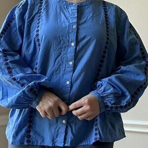 Blue embroidered cotton blouse with balloon sleeves